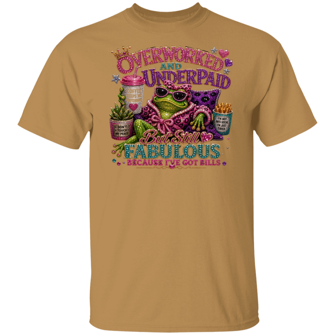 An old gold color crewneck t-shirt featuring a colorful graphic of a frog wearing sunglasses and a pink leopard-print sweater, surrounded by text that reads 'Overworked and Underpaid But Still Fabulous Because I've Got Bills'.