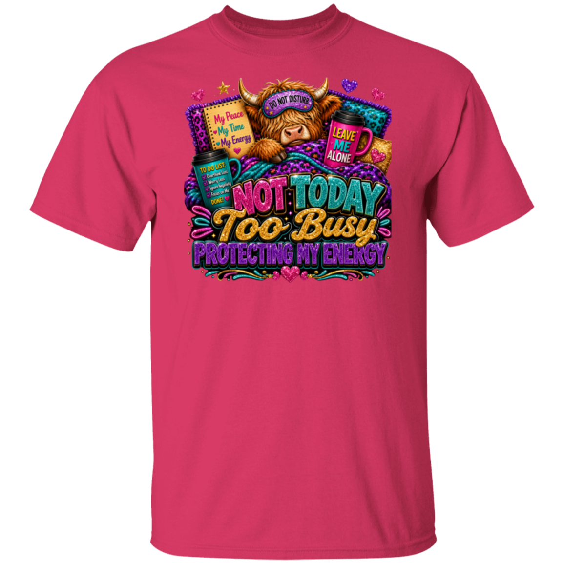 A bright pink short-sleeve crewneck t-shirt featuring a colorful graphic print on the front. The graphic depicts a highland cow wearing sunglasses with the text 'I AM NOT MOTHED' and surrounded by items like a laptop, mug, and books, with the main text reading 'NOT TODAY TOO BUSY PROTECTING MY ENERGY'.