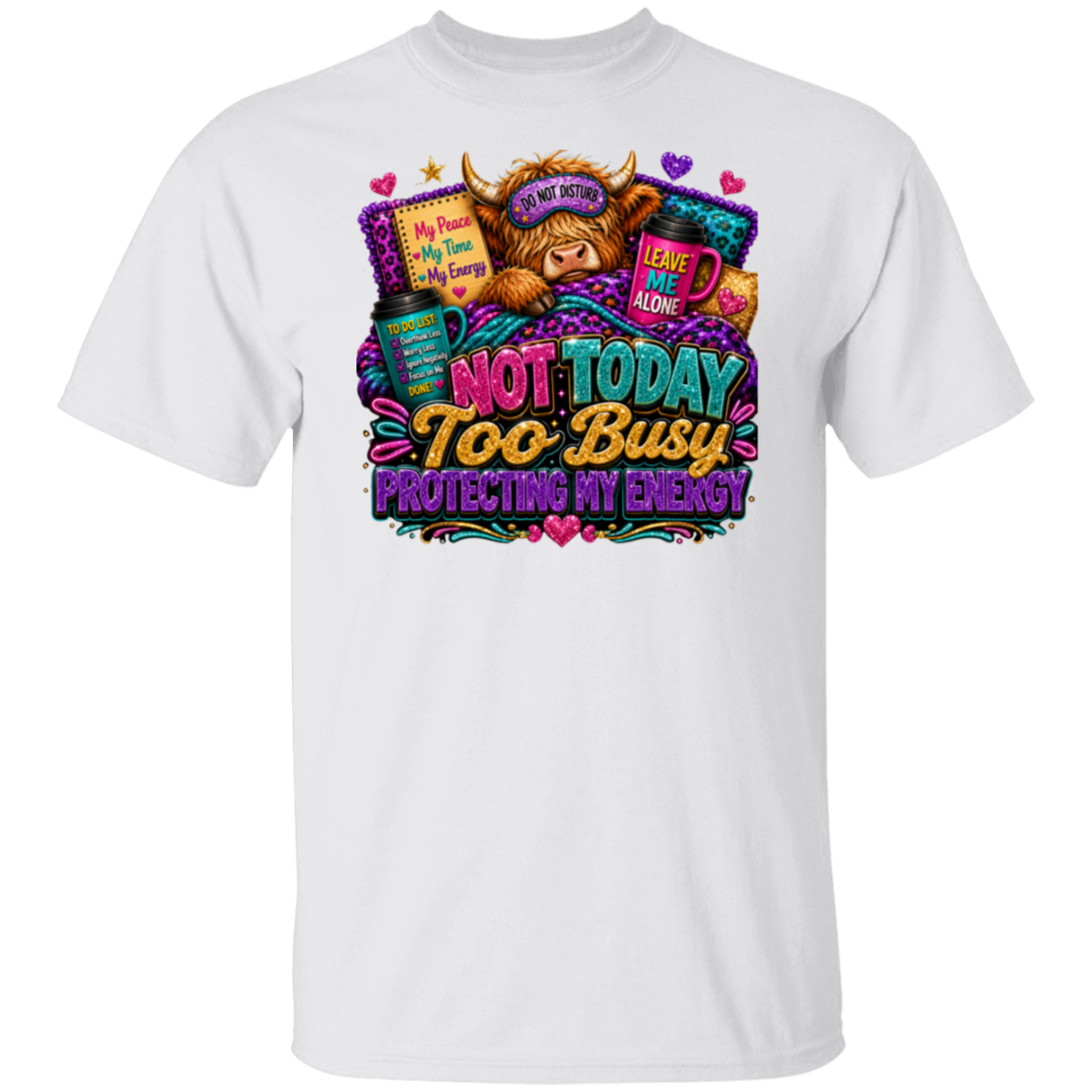 A white short-sleeve crewneck t-shirt featuring a colorful graphic print on the front. The graphic depicts a fluffy brown highland cow wearing a sleep mask and top hat, surrounded by text that reads 'NOT TODAY TOO BUSY PROTECTING MY ENERGY' in a playful, vibrant font.