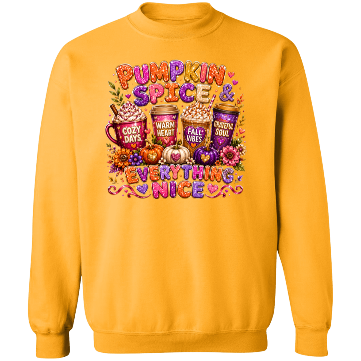 A gold color crewneck sweatshirt featuring a colorful autumn-themed graphic with the text 'Pumpkin Spice & Everything Nice' and illustrations of cozy drinks, pumpkins, and fall decorations. 