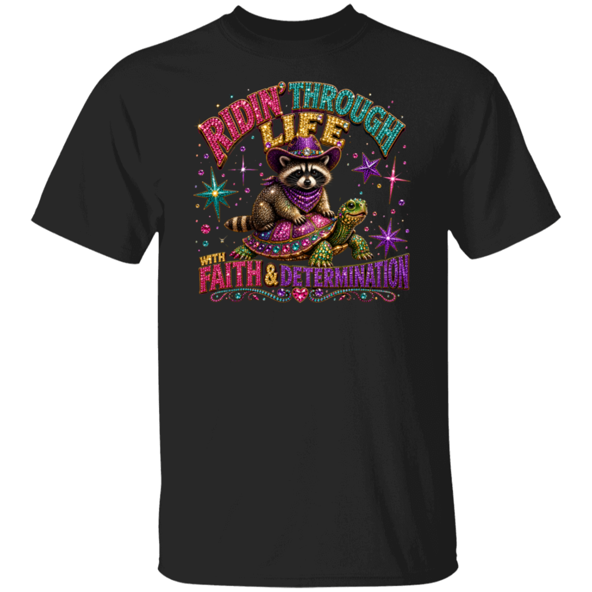 A black short-sleeve crewneck t-shirt featuring a colorful graphic print of a raccoon riding a turtle. The graphic includes the text 'RIDIN' THROUGH LIFE WITH FAITH & DETERMINATION' in a stylized neon font, set against a plain white background.