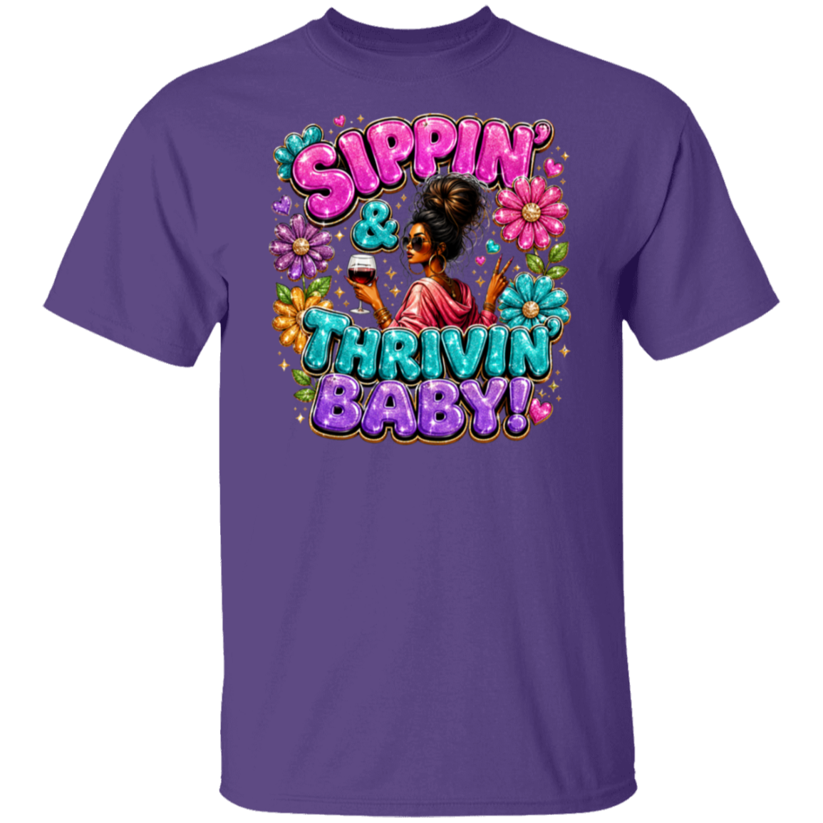 A purple short-sleeve crewneck t-shirt featuring a colorful retro graphic on the front with the text 'Sippin' & Thrivin' Baby!' in pink, blue, and purple bubble letters, surrounded by flowers and a woman holding a drink.