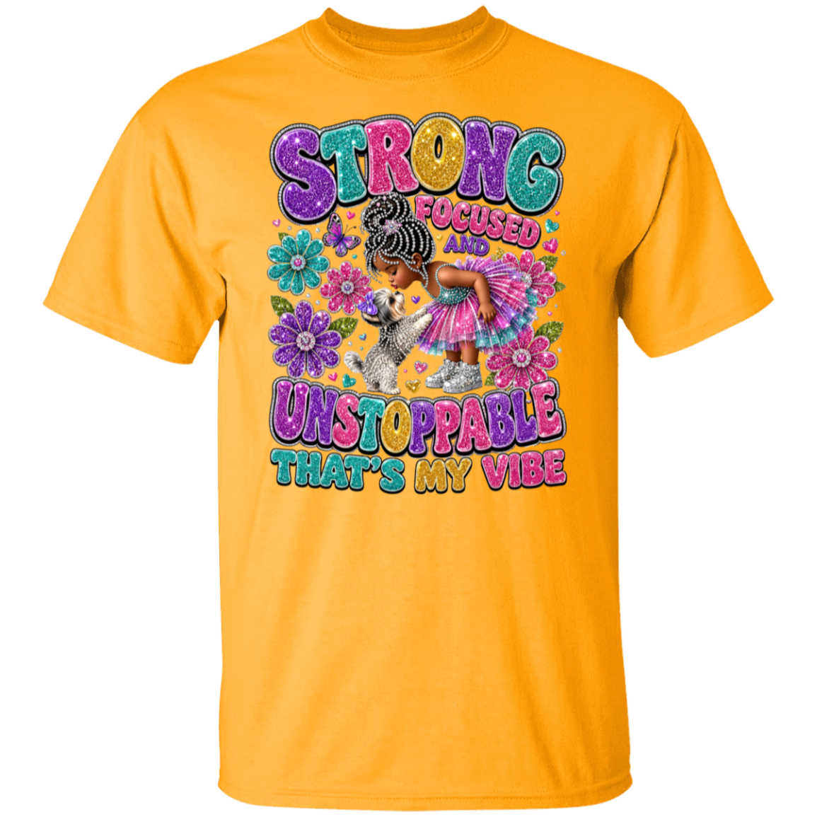 A gold color sleeve t-shirt with a colorful graphic on the front. The graphic features the text 'STRONG FOCUSED UNSTOPPABLE THAT'S MY VIBE' in a bubbly, multicolored font, surrounding an illustration of a woman with braided hair in a pink dress hugging a small white dog, with purple flowers.