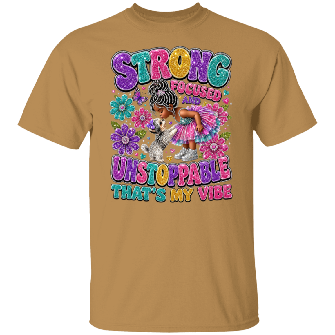 An old gold crewneck t-shirt featuring a colorful graphic print on the front. The graphic displays the text 'STRONG FOCUSED UNSTOPPABLE THAT'S MY VIBE' in a bubbly, multicolored font, surrounding an illustration of a young girl with braided hair in a pink dress and a small white dog.