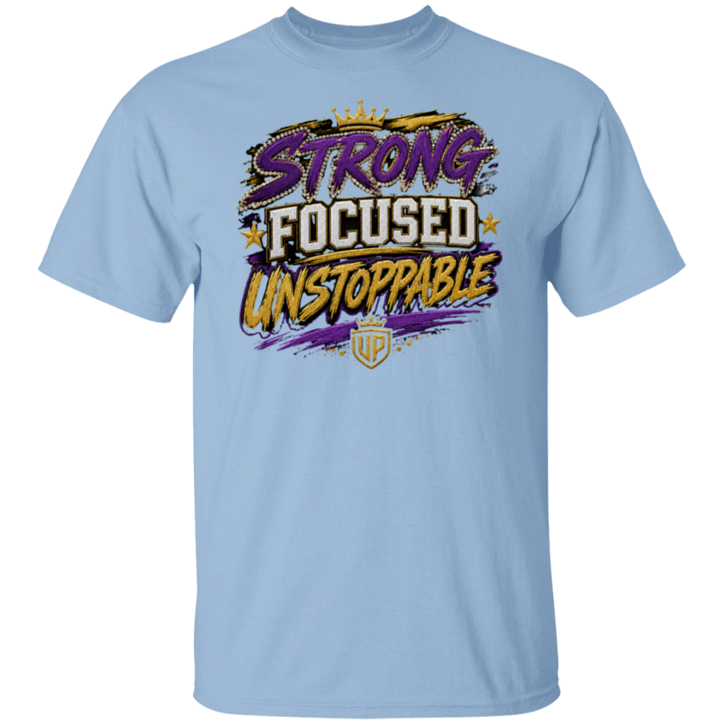 A light blue crewneck t-shirt featuring a colorful graphic on the chest with the words 'STRONG FOCUSED UNSTOPPABLE' in stylized purple, white, and yellow lettering, along with a small gold crest below.
