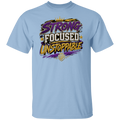A light blue crewneck t-shirt featuring a colorful graphic on the chest with the words 'STRONG FOCUSED UNSTOPPABLE' in stylized purple, white, and yellow lettering, along with a small gold crest below.