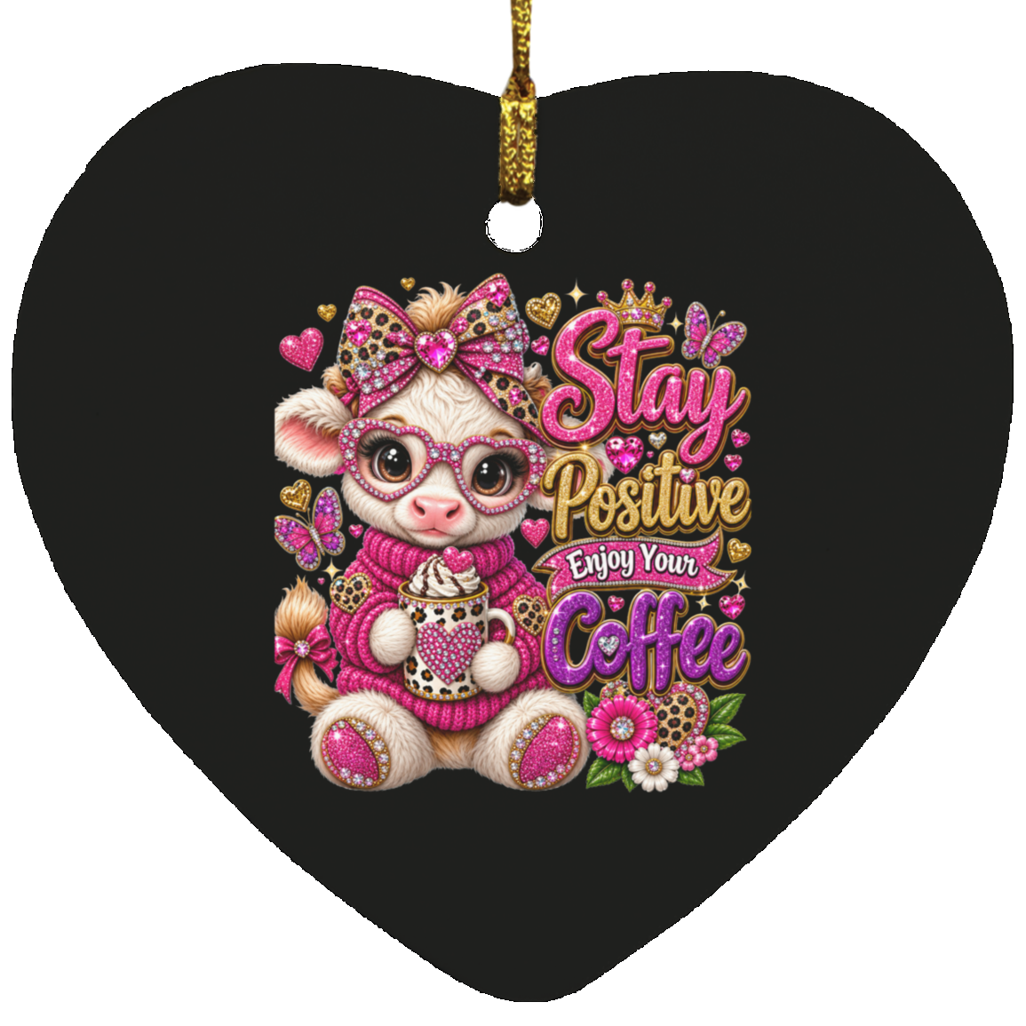 A heart-shaped black ornament featuring a cute cartoon cow wearing pink glasses, a pink sweater, and a leopard-print bow, holding a coffee cup next to the text 'Stay Positive Enjoy Your Coffee' in pink, gold, and purple lettering.