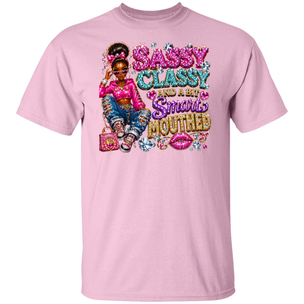 A light pink short-sleeve crewneck t-shirt featuring a colorful graphic print of a young girl with a high ponytail, pink top, and blue jeans, next to the text 'SASSY CLASSY AND A FEW Smurfs MOUTHED' in glittery pink, blue, and gold lettering.