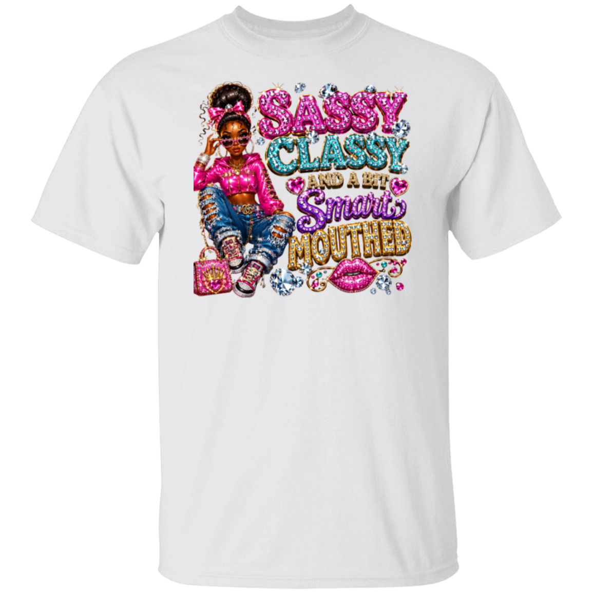 A white short-sleeve crewneck t-shirt featuring a colorful graphic print on the front. The graphic depicts a young girl with braided hair wearing a pink top and ripped blue jeans, sitting next to a pink purse, with the text 'SASSY CLASSY AND A BIT Smarts MOUTHED' in glittery pink, blue, and gold lettering.