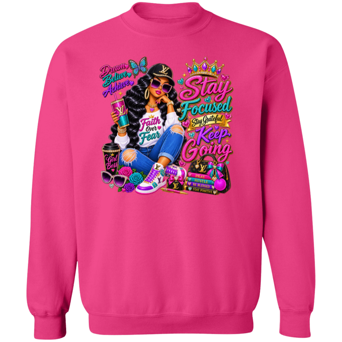 A heliconia crewneck sweatshirt featuring a colorful graphic print on the front. The graphic depicts a woman in a black hat and sunglasses holding a drink, surrounded by various colorful items, with text including 'Dream Big Live Alway', 'Stay Focused Say Good Morning Keep Going', and 'Faith Never Fear'.