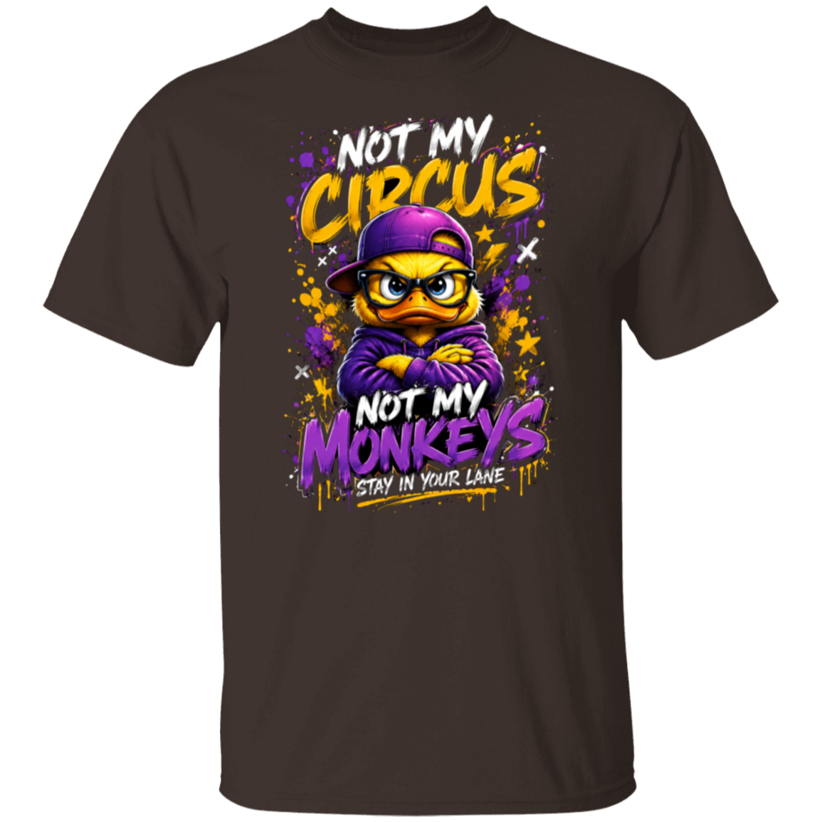 A dark chocolate color short-sleeve t-shirt with a colorful graphic print on the front. The graphic features a cartoon monkey wearing a purple cap and hoodie, surrounded by the text 'NOT MY CIRCUS', 'NOT MY MONKEYS', and 'STAY IN YOUR LANE' in yellow, purple, and white.