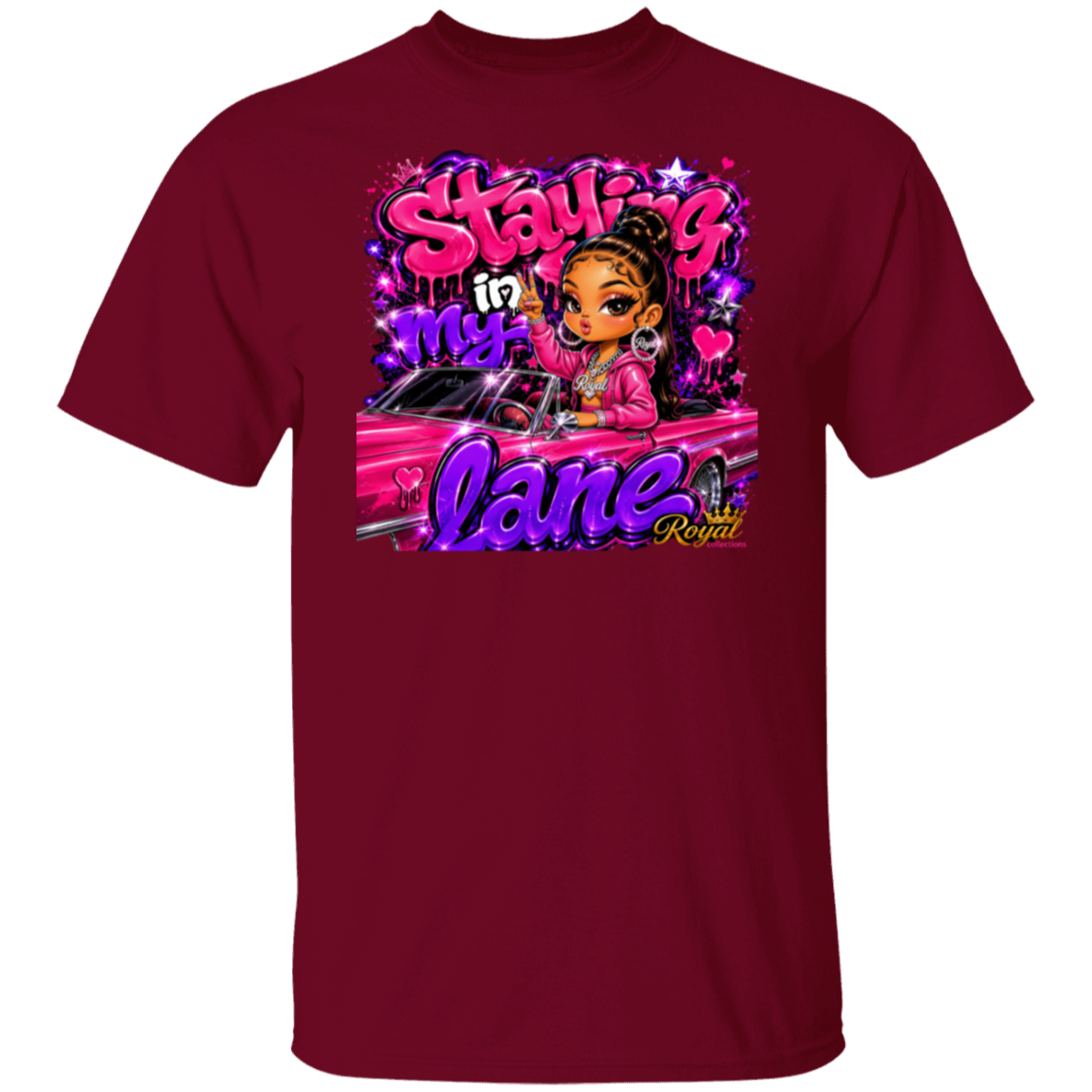 A garnet short-sleeve crewneck t-shirt featuring a colorful graphic print on the front. The graphic shows a cartoon girl with brown skin and black hair in a bun, sitting in a pink car with the text 'Staying in my lane Royal' in stylized pink and purple lettering.