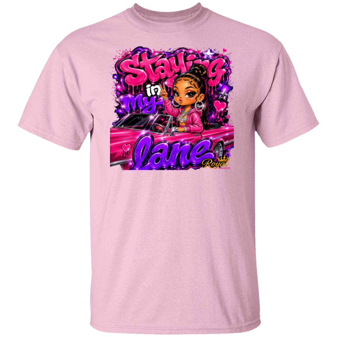 A light pink short-sleeve crewneck t-shirt featuring a colorful graphic print on the front. The graphic displays a cartoon woman with brown skin and black hair in a bun, wearing a pink jacket, sitting in a pink car, with the text 'Staying in my lane' in stylized pink and purple lettering.
