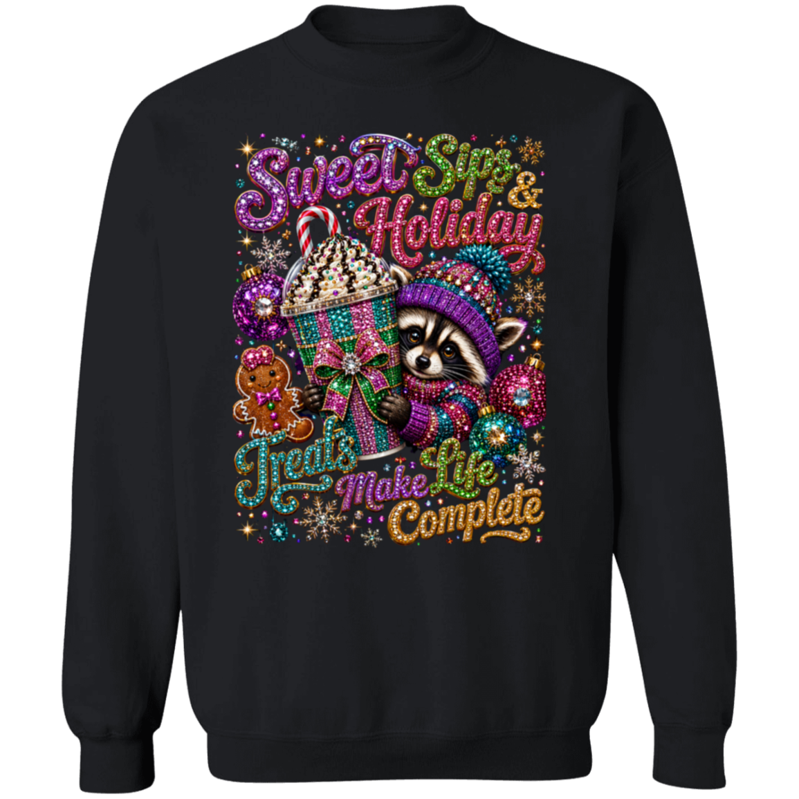 A black crewneck sweatshirt featuring a vibrant, multi-colored Christmas graphic on the front. The graphic includes a raccoon in a purple knit hat, a gingerbread cookie, a cupcake, and festive text that reads 'Sweet Sin & Holiday Treats Make Life Complete' decorated with glittery lettering and holiday motifs.