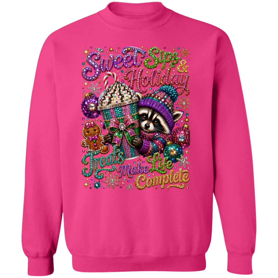 A heliconia color crewneck sweatshirt featuring a colorful graphic of a raccoon in a knit hat next to a hot chocolate cup, with the text 'Sweet Spots & Holiday Treats Make Life Complete' in glittery, decorative fonts.