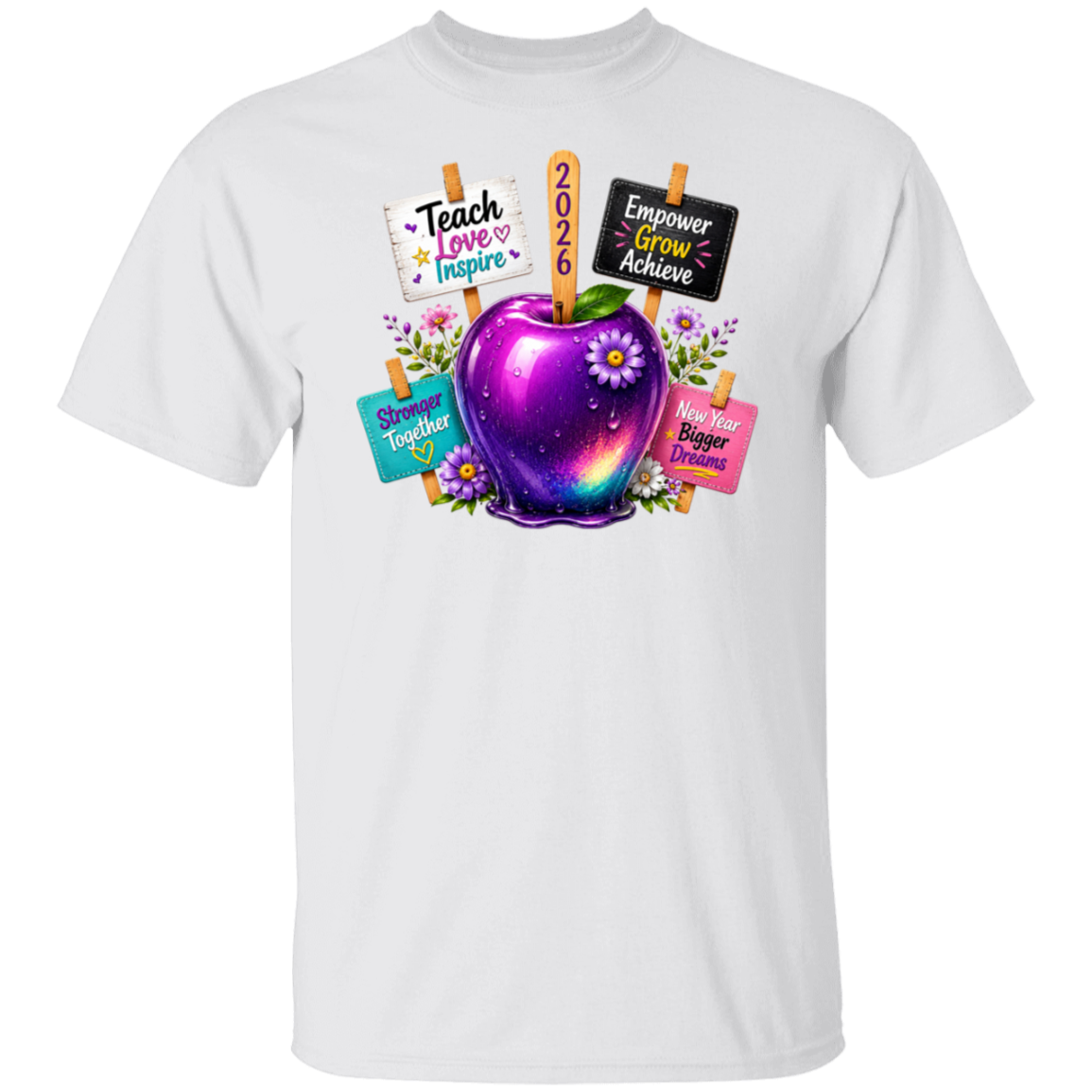 A white short-sleeve crewneck t-shirt featuring a colorful graphic of a glowing purple galaxy apple with flowers and signs that read 'Teach Love Inspire', '2026', 'Empower Grow Achieve', 'Show Up Together', and 'Have Bigger Dreams'.