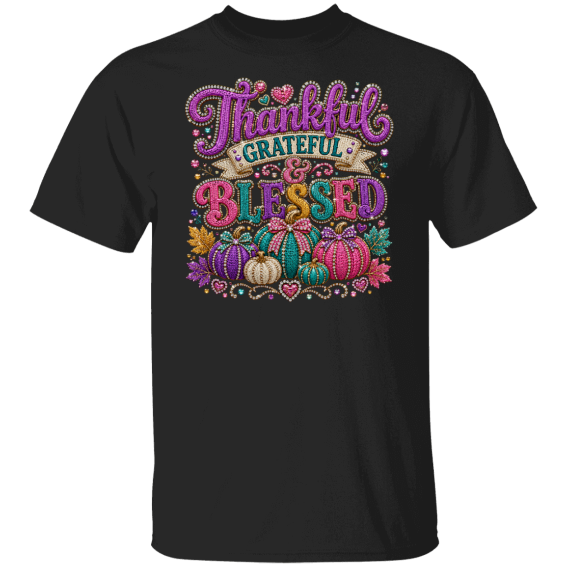 A black color short-sleeve crewneck t-shirt featuring a colorful, glittery graphic on the front that reads 'Thankful GRATEFUL & BLESSED' surrounded by autumn pumpkins, hearts, and fall foliage.