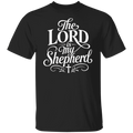 A black short-sleeve crewneck t-shirt with a white graphic print on the front reading 'The LORD is my Shepherd' in an elegant cursive and serif font, featuring a small cross at the bottom.