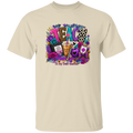 A natural crewneck t-shirt featuring a colorful graphic print on the front with the word 'TEACH' surrounded by flowers, a drink, and the text 'To my Best Teacher'.
