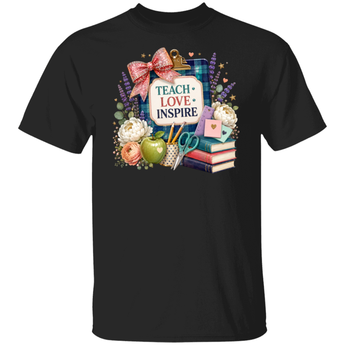 A black short-sleeve crewneck t-shirt featuring a colorful graphic print on the front. The graphic includes a clipboard with a pink bow, the words 'TEACH LOVE INSPIRE' in red and blue, a green apple, books, scissors, flowers, and other school-themed illustrations.