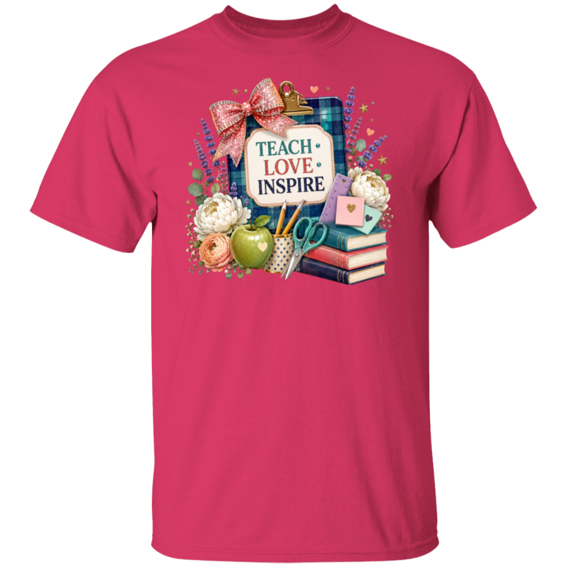 A heliconia color short-sleeve crewneck t-shirt featuring a colorful graphic print on the chest. The graphic depicts a clipboard with a plaid flag, a red bow, a sign reading 'TEACH LOVE INSPIRE', an apple, flowers, and books.