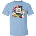 A light blue short-sleeve crewneck t-shirt featuring a colorful 'Teacher Love Inspire' graphic on the chest, displayed against a solid white background.