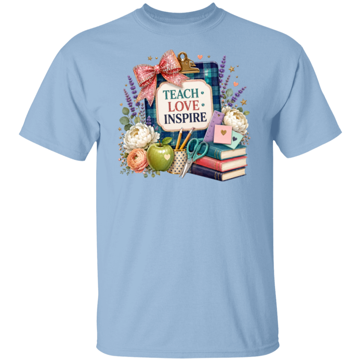A light blue short-sleeve crewneck t-shirt featuring a colorful 'Teacher Love Inspire' graphic on the chest, displayed against a solid white background.