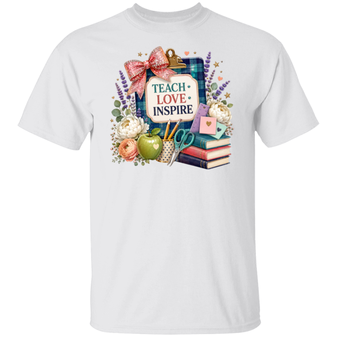A white short-sleeve crewneck t-shirt featuring a colorful graphic print on the front. The graphic displays a clipboard with a pink bow and the words 'TEACH LOVE INSPIRE' surrounded by school-themed illustrations including an apple, books, scissors, and flowers.