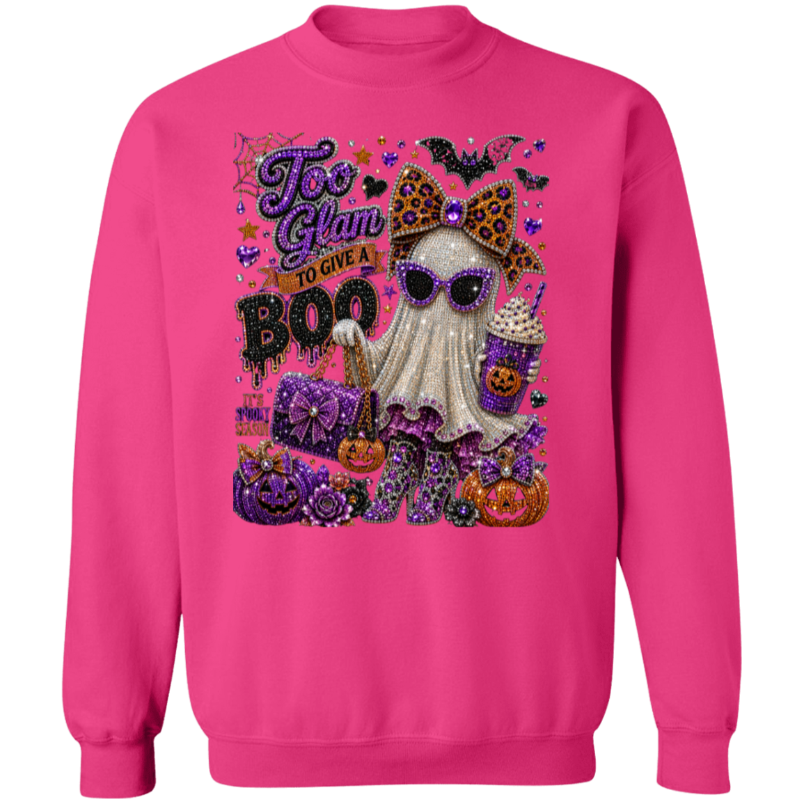 An heliconia crewneck sweatshirt featuring a large, detailed Halloween graphic on the front. The graphic includes a ghost character wearing sunglasses and a leopard-print bow, surrounded by pumpkins, bats, purple glittery text reading 'Too Glam to Give a BOO', and other spooky decorative elements.