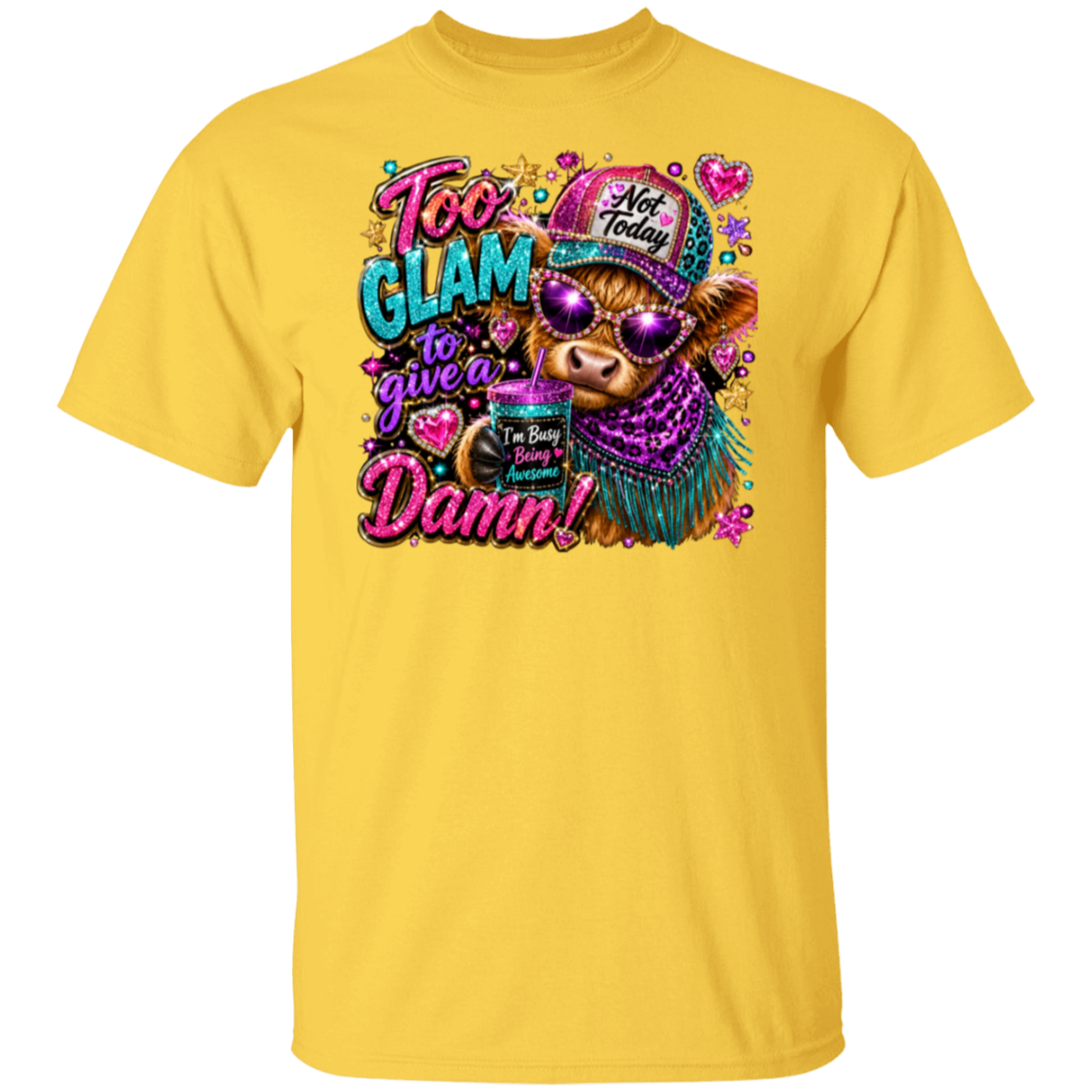 A daisy color short-sleeve crewneck t-shirt featuring a colorful graphic print of a cow wearing a glittery hat and sunglasses, with the text 'Too Glam to give a Damn!' and 'I'm Not Busy Right Now'.
