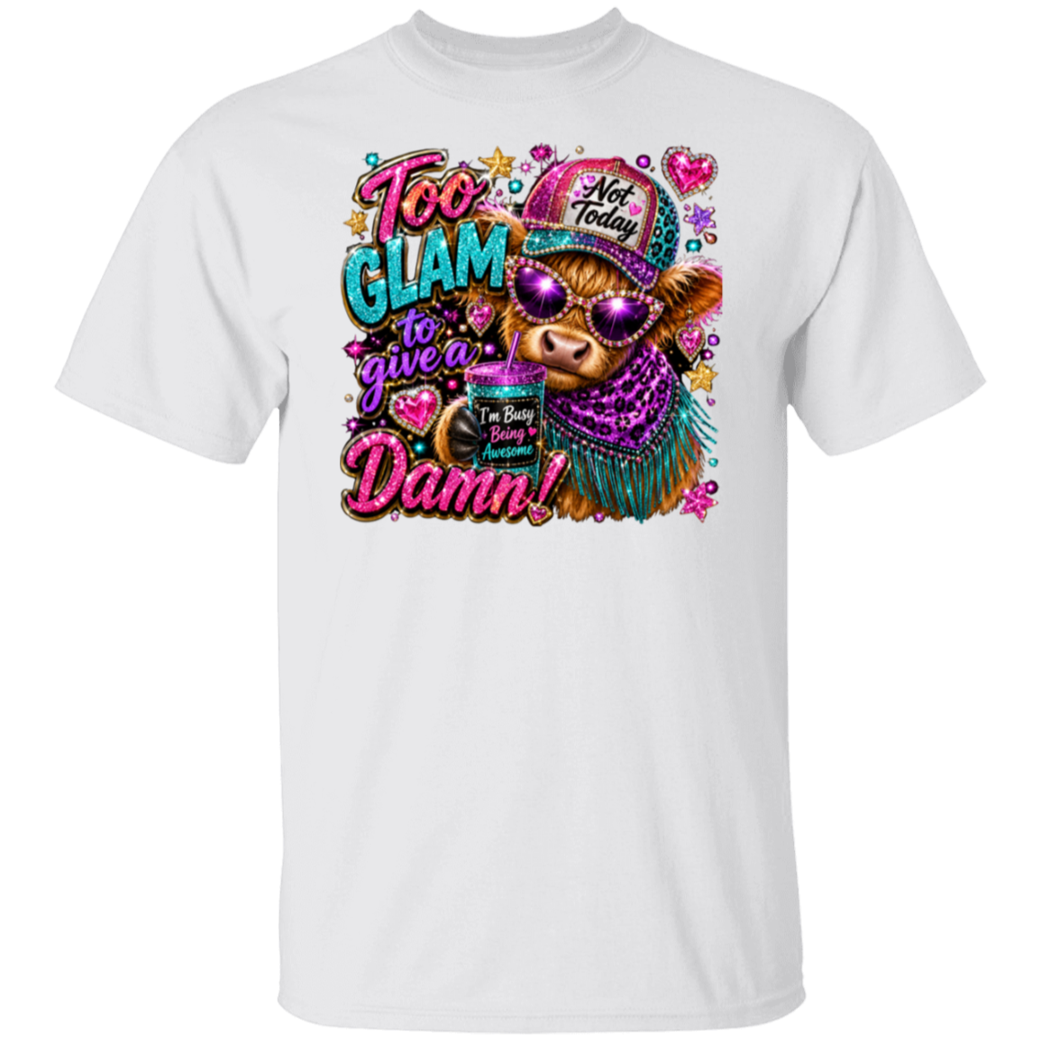 A white short-sleeve crewneck t-shirt featuring a colorful graphic print on the front. The graphic depicts a cartoon cow wearing a purple glittery hat and sunglasses, holding a cup with the text 'I'm So Busy I Need A Drink', surrounded by the text 'Too Glam to give a Damn!' and decorative elements like hearts and stars.