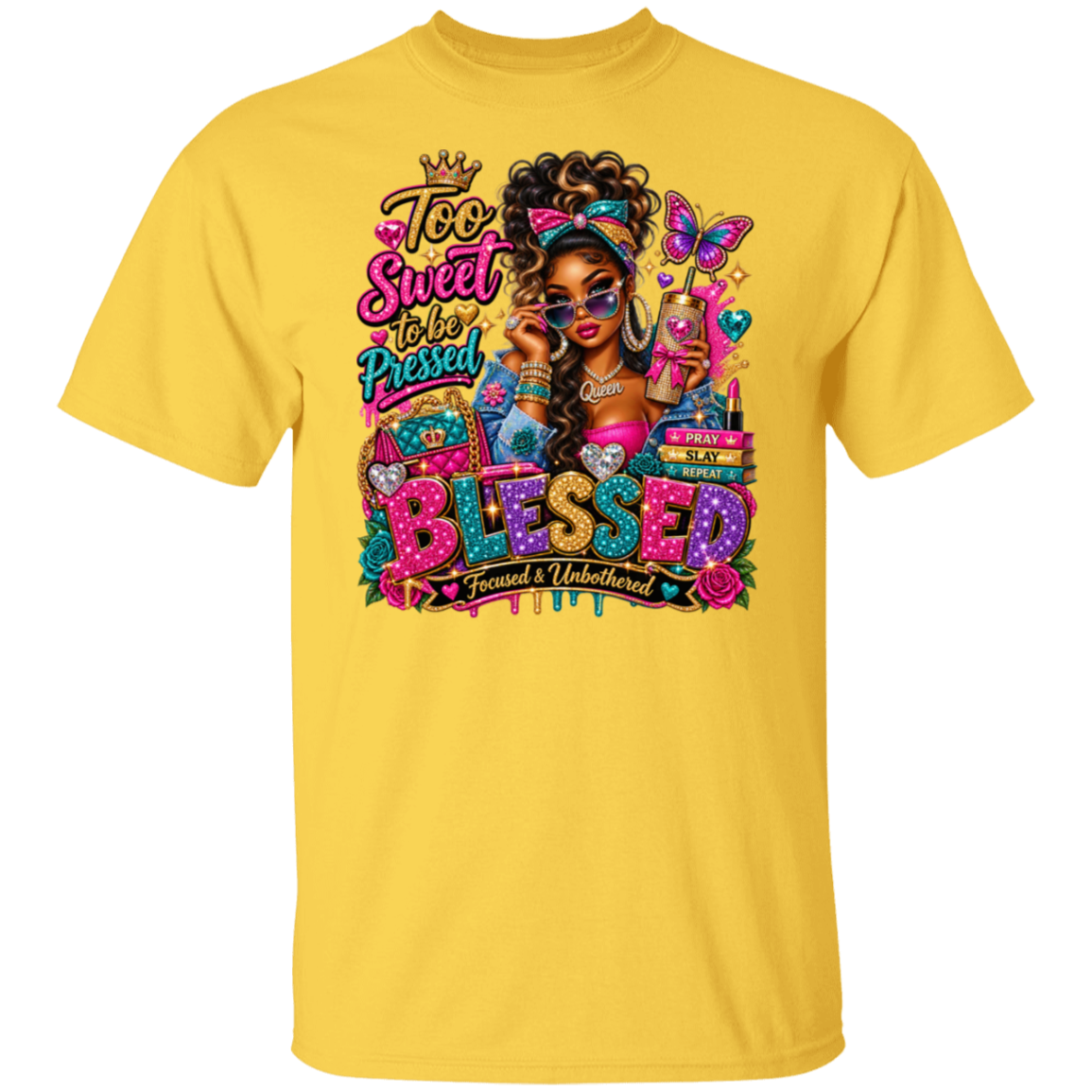 A daisy short-sleeve crewneck t-shirt featuring a colorful graphic print on the front. The graphic depicts a Black woman with sunglasses, a butterfly, and the text 'Too Sweet to Be Pressed' and 'BLESSED Focused & Unburdened'.