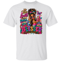 A white short-sleeve crewneck t-shirt featuring a colorful graphic print on the front. The graphic depicts a Black woman with sunglasses, a phone, and a purse, surrounded by glittery text that reads 'Too Sweet to be Pretentious' and 'BLESSED Focused & Unchained'.
