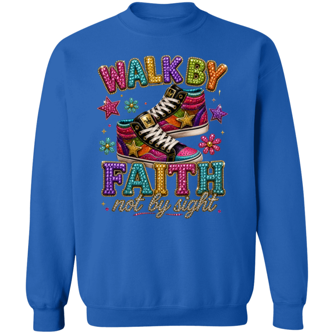 A royal blue crewneck sweatshirt featuring a colorful graphic print on the front. The graphic displays the text 'WALK BY FAITH not by sight' in a glittery, multi-colored font, surrounding an illustration of a pair of pink and purple high-top sneakers decorated with gold stars.
