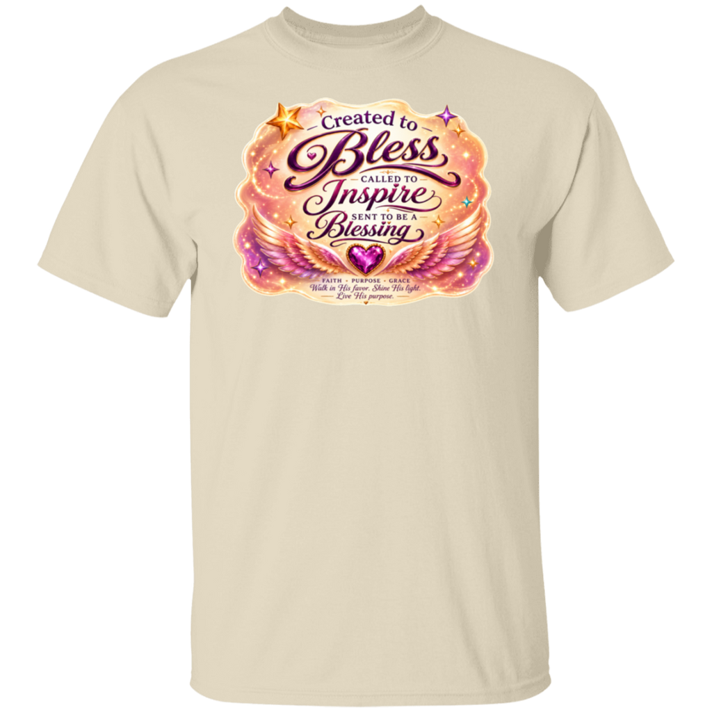 A natural crewneck t-shirt featuring a colorful graphic print on the chest with the text 'Created to Bless Called to Inspire Love in the Blessing' surrounded by pink, orange, and purple angel wings and stars.