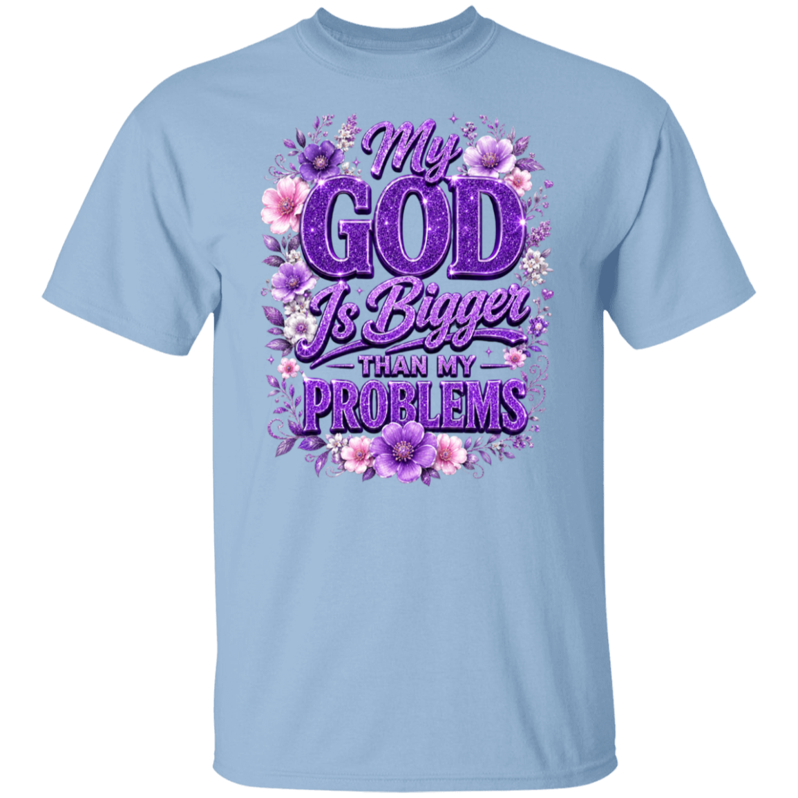 A light blue short-sleeve crewneck t-shirt featuring a purple and pink graphic print on the front with the text 'My GOD Is Bigger THAN MY PROBLEMS' surrounded by purple and pink flowers.